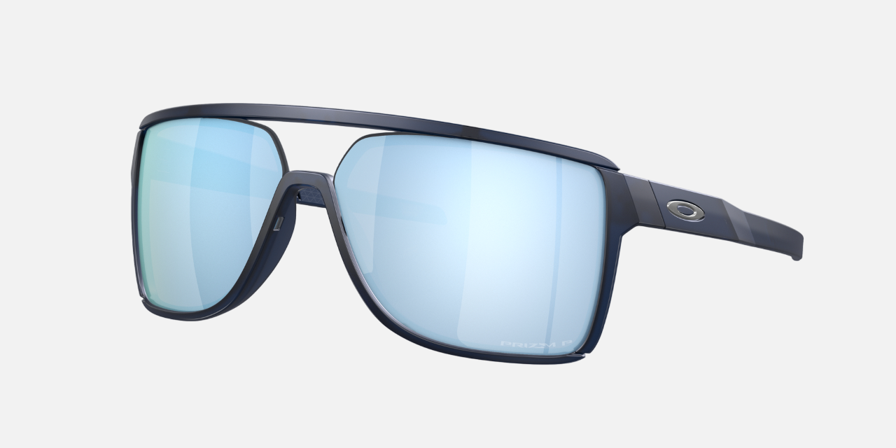 Oakley Castel 06 rectangular sunglasses for men in semi-rimless plastic, with blue frame, and blue lenses. 63mm in lens size, 12mm in bridge size, and 133mm in temple length.
