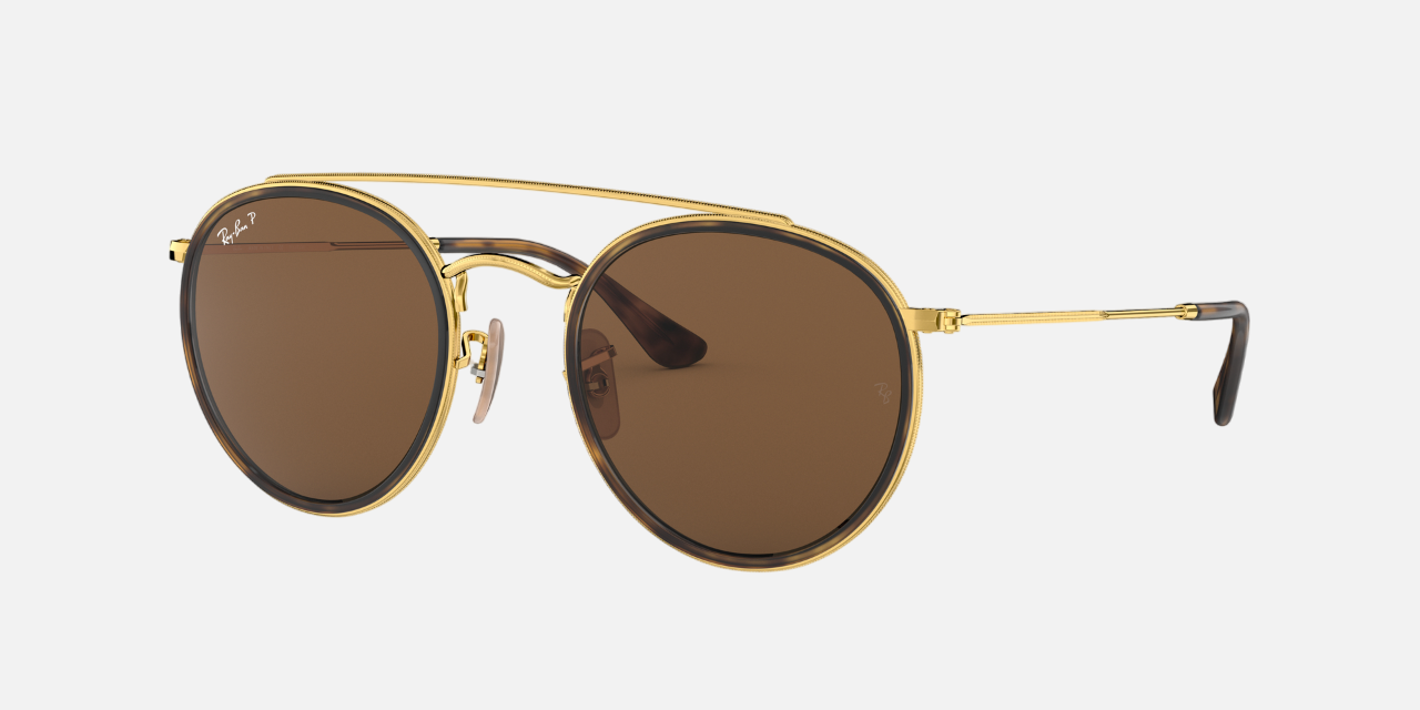 Ray-Ban RB3647N 001/57 round sunglasses for unisex in full rim metal, with gold frame, and brown lenses. 51mm in lens size, 22mm in bridge size, and 145mm in temple length.