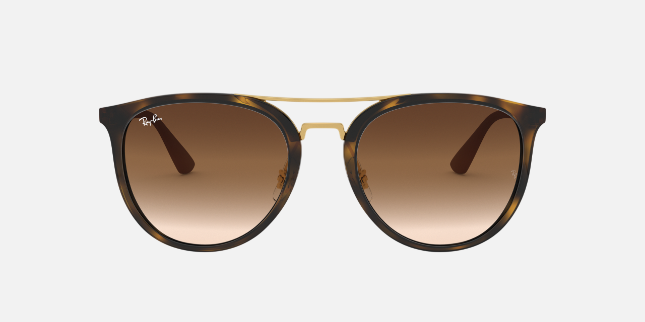 Ray-Ban RB4285 710/13 phantos sunglasses for unisex in full rim injected, with polished light havana frame, and brown gradient lenses. 55mm in lens size, 20mm in bridge size, and 145mm in temple length.