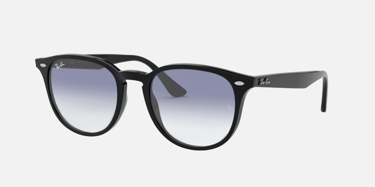 Ray-Ban RB4259 601/19 round sunglasses for unisex in full rim plastic, with black frame, and clear gradient light blue lenses. 51mm in lens size, 20mm in bridge size, and 145mm in temple length.