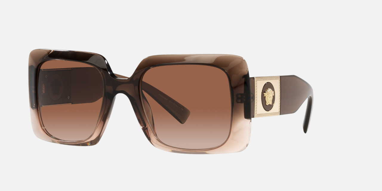 Versace VE4405 533213 rectangular sunglasses for women in full rim plastic, with transparent brown gradient frame, and brown gradient lenses. 54mm in lens size, 22mm in bridge size, and 140mm in temple length.
