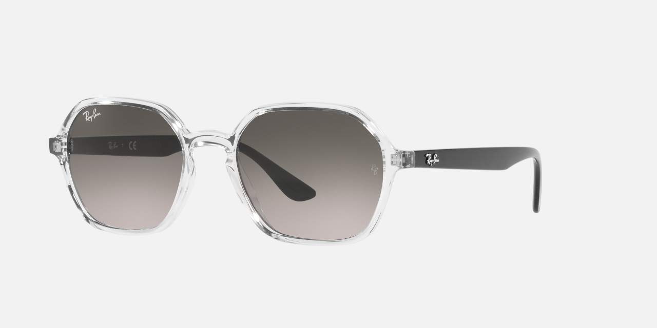 Ray-Ban RB4361 647711 irregular sunglasses for unisex in full rim plastic, with transparent frame, and grey gradient lenses. 52mm in lens size, 18mm in bridge size, and 145mm in temple length.