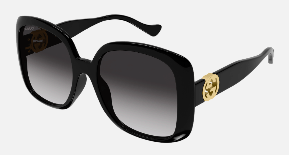 Gucci GG1029SA 007 round sunglasses for women in full rim plastic, with black frame, and grey gradient lenses. 57mm in lens size, 19mm in bridge size, and 145mm in temple length.