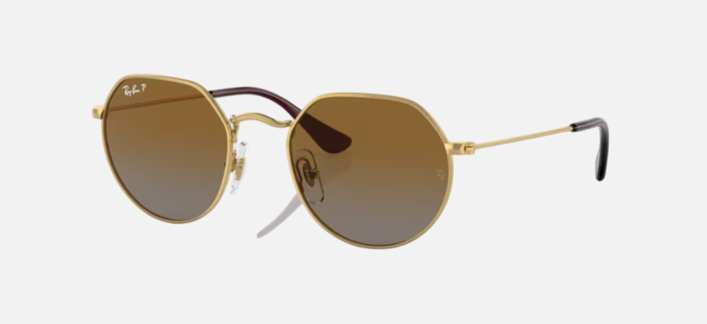 Ray-Ban Junior Jack Kids RJ9565S 223/T5 irregular sunglasses for kids in full rim metal, with polished arista gold frame, and brown polarized lenses. 47mm in lens size, 19mm in bridge size, and 130mm in temple length.