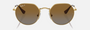 Ray-Ban Junior Jack Kids RJ9565S 223/T5 irregular sunglasses for kids in full rim metal, with polished arista gold frame, and brown polarized lenses. 47mm in lens size, 19mm in bridge size, and 130mm in temple length.
