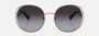 Bvlgari BV6181B 20148G round sunglasses for women in semi-rimless metal, with pink gold frame, and grey gradient lenses. 57mm in lens size, 20mm in bridge size, and 140mm in temple length.