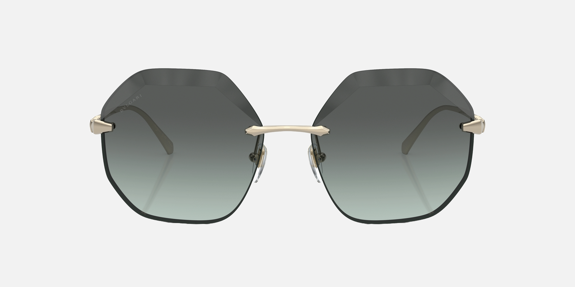 Bvlgari BV6187K 278/2A irregular sunglasses for women in rimless metal, with pale gold plated frame, and green gradient lenses. 59mm in lens size, 16mm in bridge size, and 140mm in temple length.