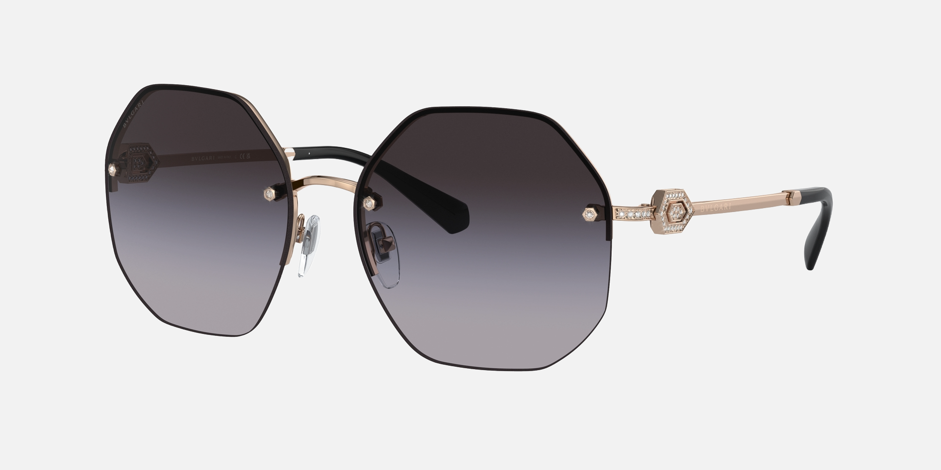 Bvlgari BV6122B 20148G irregular sunglasses for women in full rim metal, with pink gold frame, and grey gradient lenses. 58mm in lens size, 16mm in bridge size, and 140mm in temple length.
