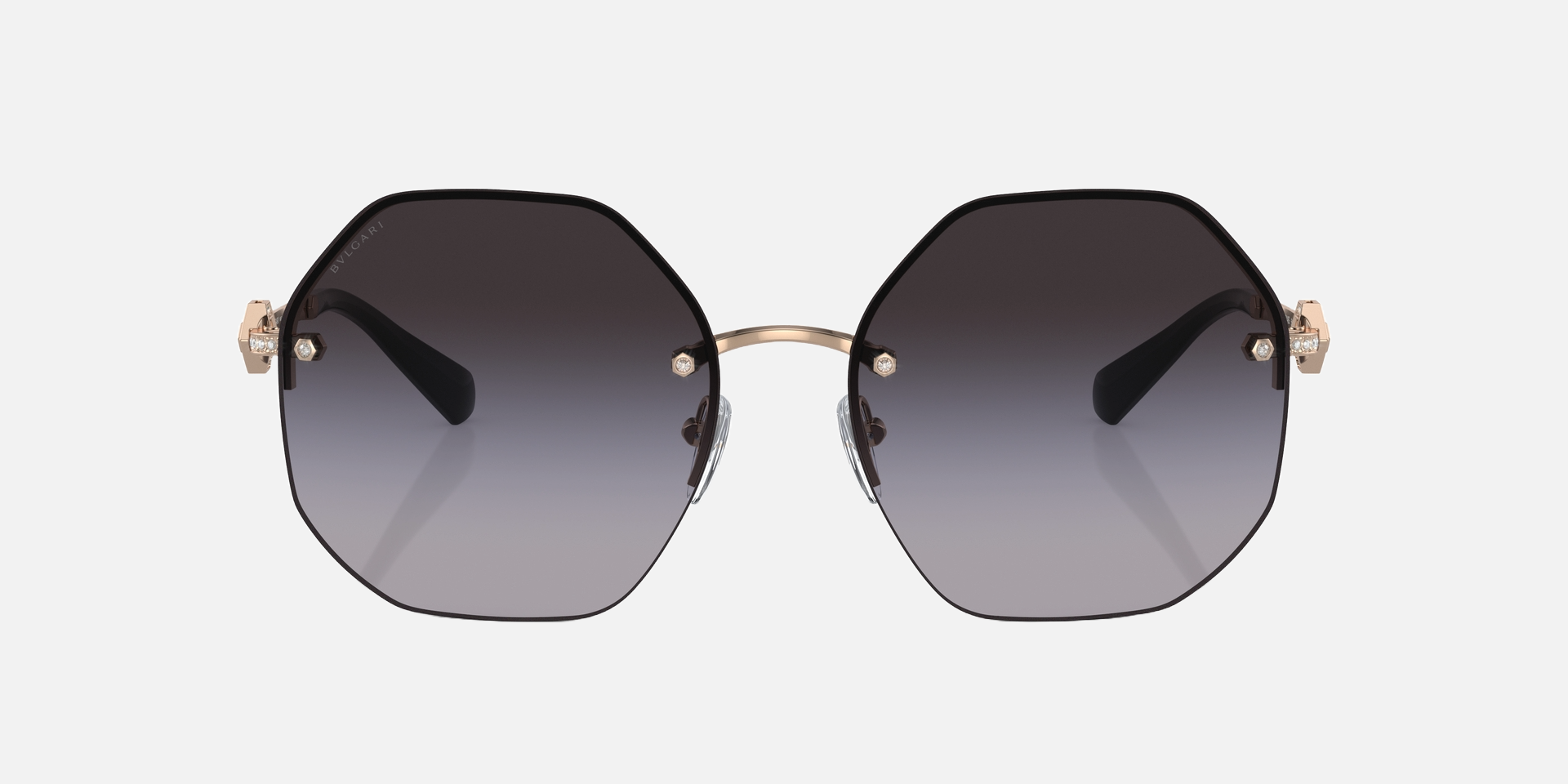 Bvlgari BV6122B 20148G irregular sunglasses for women in full rim metal, with pink gold frame, and grey gradient lenses. 58mm in lens size, 16mm in bridge size, and 140mm in temple length.