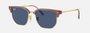 Ray-Ban Junior New Clubmaster RJ9116S 715680 irregular sunglasses for kids in full rim injected, with opal pink on gold frame, and dark blue lenses. 47mm in lens size, 17mm in bridge size, and 125mm in temple length.