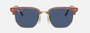 Ray-Ban Junior New Clubmaster RJ9116S 715680 irregular sunglasses for kids in full rim injected, with opal pink on gold frame, and dark blue lenses. 47mm in lens size, 17mm in bridge size, and 125mm in temple length.