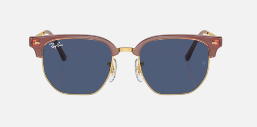 Ray-Ban Junior New Clubmaster RJ9116S 715680 irregular sunglasses for kids in full rim injected, with opal pink on gold frame, and dark blue lenses. 47mm in lens size, 17mm in bridge size, and 125mm in temple length.