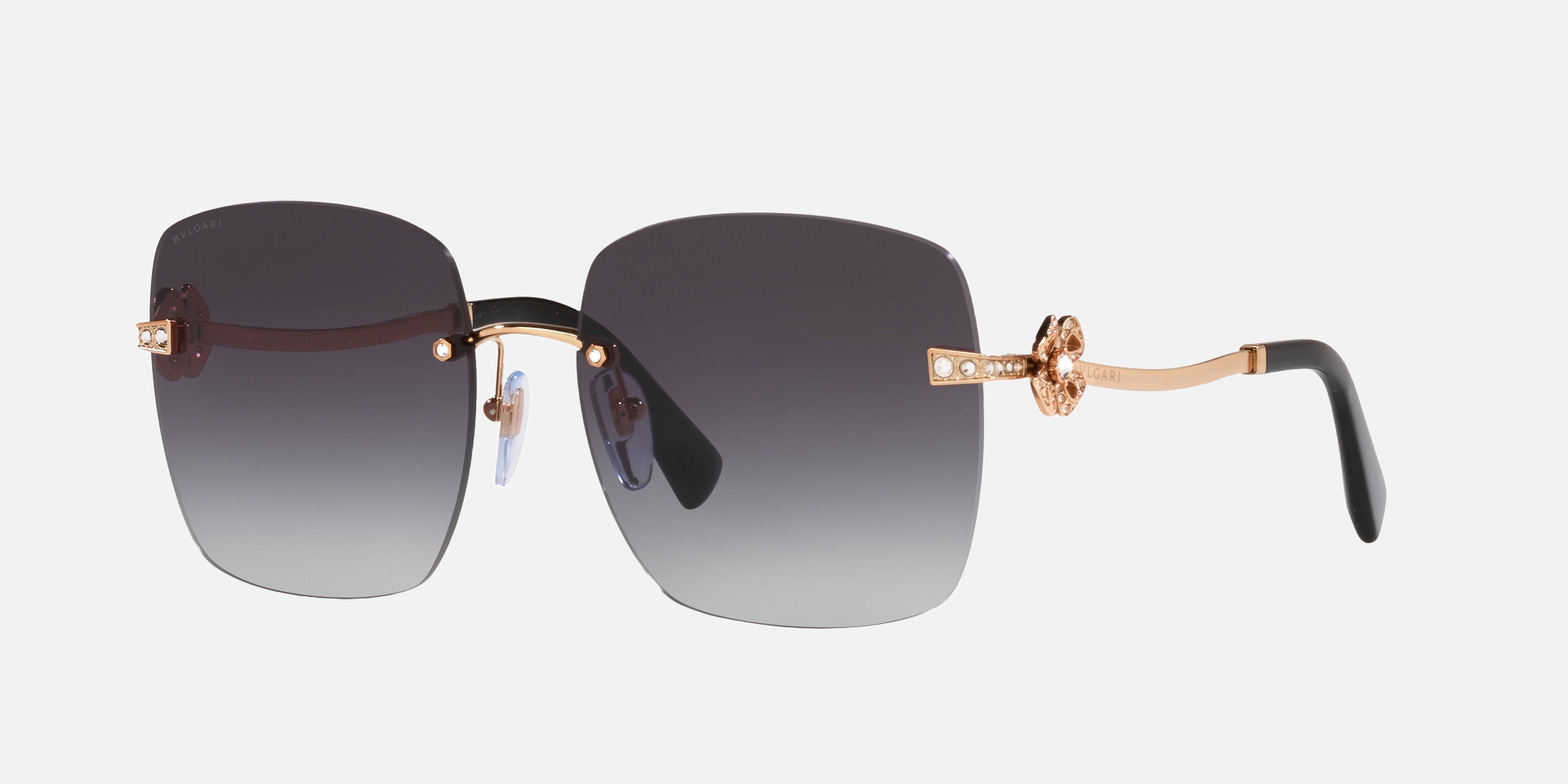 Bvlgari BV6173B 20148G square sunglasses for women in rimless metal, with pink gold frame, and grey gradient lenses. 58mm in lens size, 17mm in bridge size, and 140mm in temple length.