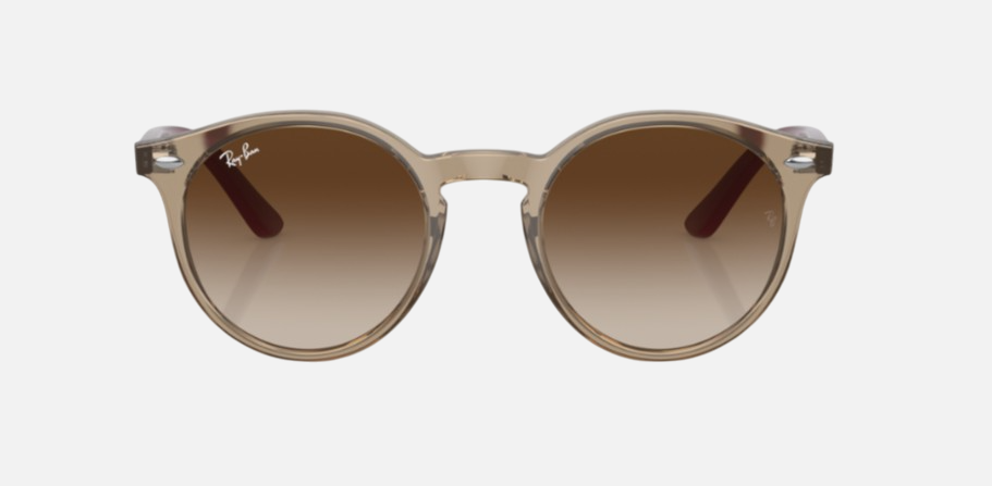Ray-Ban Junior RJ9064S 712313 phantos sunglasses for kids in full rim injected, with polished transparent brown frame, and brown lenses. 44mm in lens size, 19mm in bridge size, and 130mm in temple length.