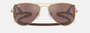 Ray-Ban Junior Aviator Kids RJ9506S 223/6G pilot sunglasses for kids in full rim metal, with polished arista gold frame, and brown mirror silver lenses. 52mm in lens size, 14mm in bridge size, and 125mm in temple length.