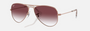 Ray-Ban Junior Aviator Kids RJ9506S 291/8H pilot sunglasses for kids in full rim metal, with polished rose gold frame, and gradient dark violet lenses. 52mm in lens size, 14mm in bridge size, and 125mm in temple length.