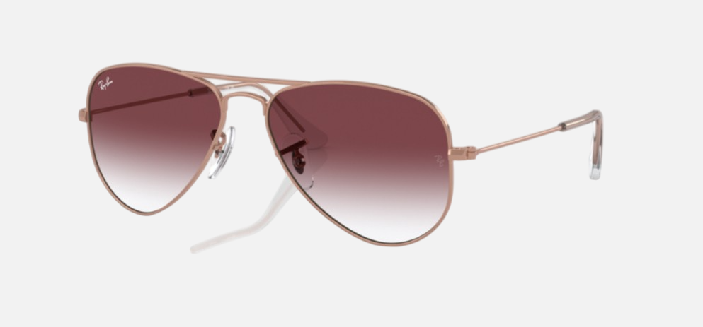 Ray-Ban Junior Aviator Kids RJ9506S 291/8H pilot sunglasses for kids in full rim metal, with polished rose gold frame, and gradient dark violet lenses. 52mm in lens size, 14mm in bridge size, and 125mm in temple length.