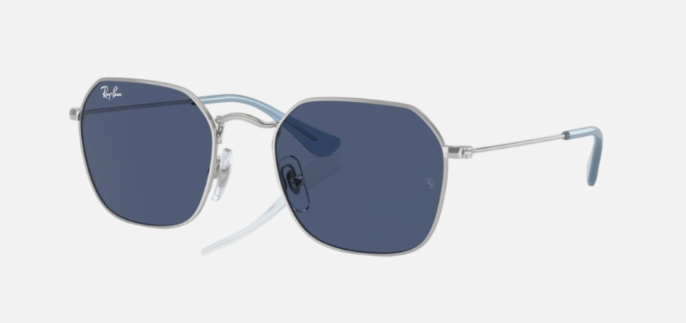 Ray-Ban Junior RJ9594S 212/80 irregular sunglasses for kids in full rim metal, with silver frame, and dark blue lenses. 49mm in lens size, 19mm in bridge size, and 130mm in temple length.