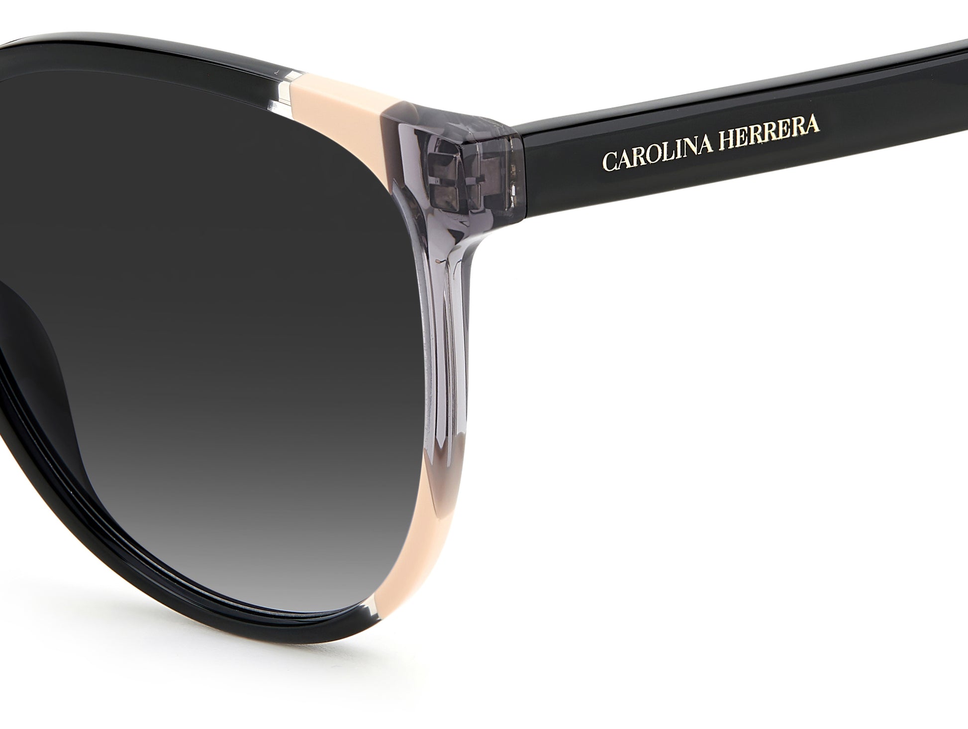 Carolina Herrera CH 0063/S KDX oval sunglasses for women in full rim plastic, with black nude frame, and gradient grey lenses. 58mm in lens size, 17mm in bridge size, and 145mm in temple length.