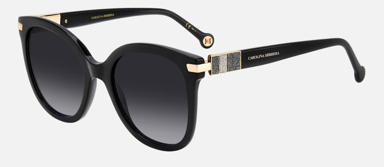 Carolina Herrera HER 0134/S 807 oval sunglasses for women in full rim plastic, with black frame, and gradient grey lenses. 55mm in lens size, 21mm in bridge size, and 145mm in temple length.