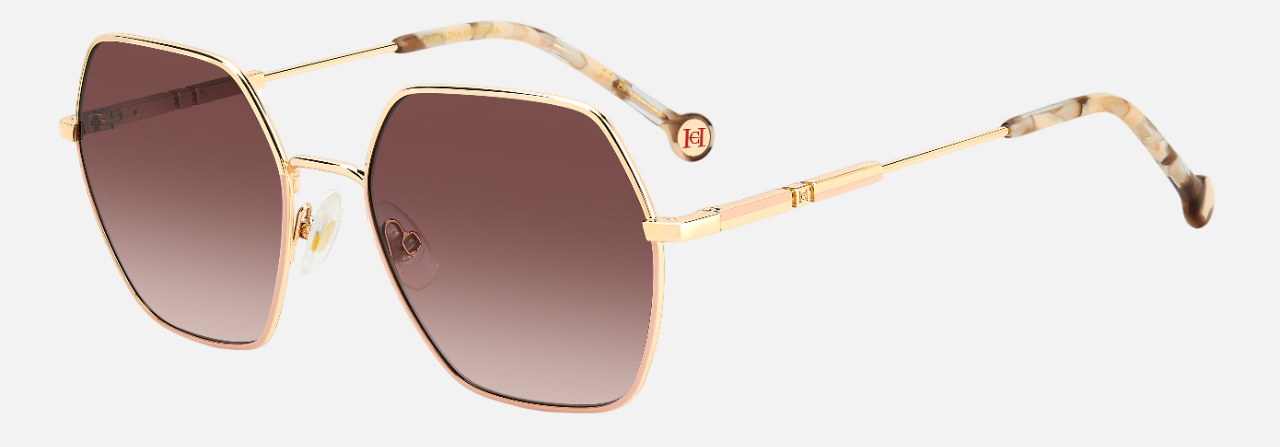 Carolina Herrera HER 0183/S BKU hexagonal sunglasses for women in full rim metal, with gold nude frame, and gradient brown lenses. 55mm in lens size, 18mm in bridge size, and 145mm in temple length.
