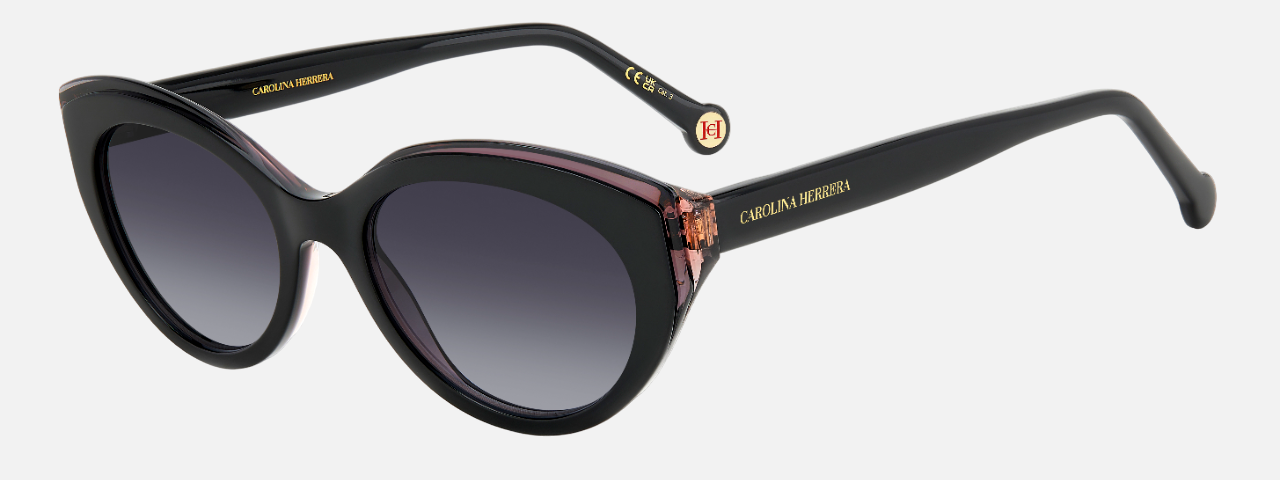 Carolina Herrera HER 0250/S 807 cat eye sunglasses for women in full rim plastic, with black frame, and gradient grey lenses. 52mm in lens size, 19mm in bridge size, and 145mm in temple length.
