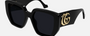 Gucci GG0956S 003 cat eye sunglasses for women in full rim plastic, with black frame, and grey lenses. 54mm in lens size, 19mm in bridge size, and 145mm in temple length.