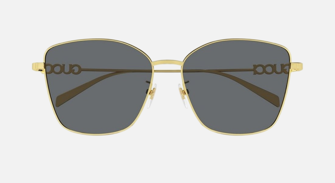 Gucci GG1805SA 001 cat eye sunglasses for women in full rim metal, with gold frame, and grey lenses. 60mm in lens size, 15mm in bridge size, and 145mm in temple length.