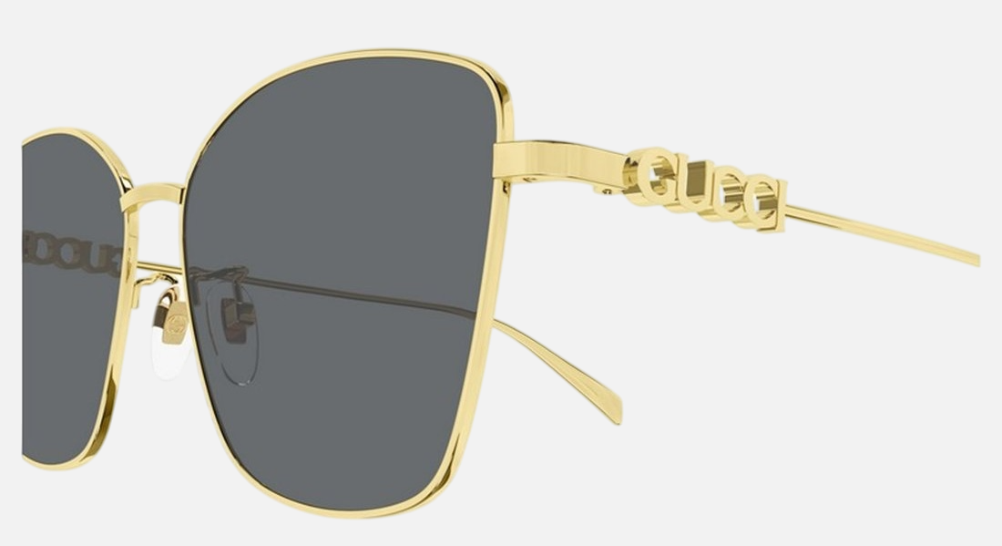 Gucci GG1805SA 001 cat eye sunglasses for women in full rim metal, with gold frame, and grey lenses. 60mm in lens size, 15mm in bridge size, and 145mm in temple length.