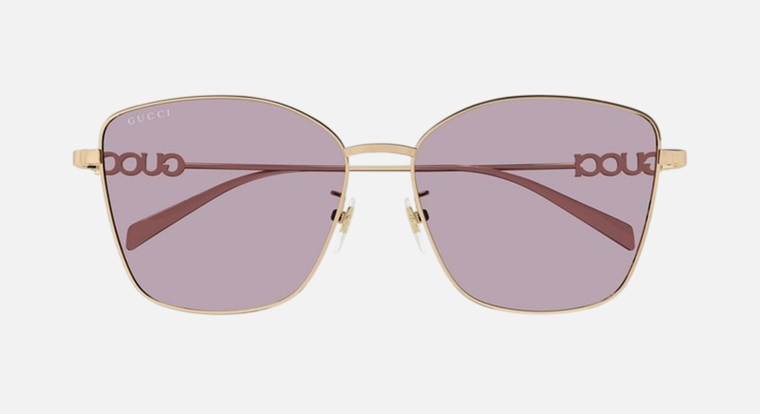 Gucci GG1805SA 003 cat eye sunglasses for women in full rim metal, with gold frame, and violet lenses. 60mm in lens size, 15mm in bridge size, and 145mm in temple length.