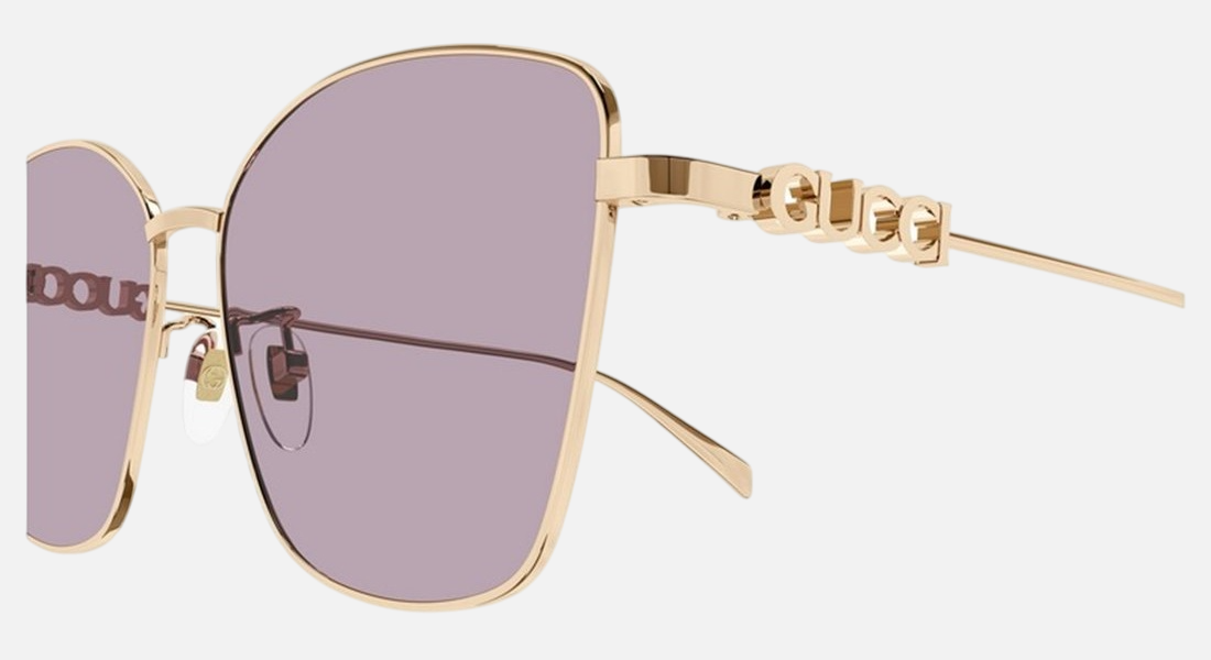 Gucci GG1805SA 003 cat eye sunglasses for women in full rim metal, with gold frame, and violet lenses. 60mm in lens size, 15mm in bridge size, and 145mm in temple length.