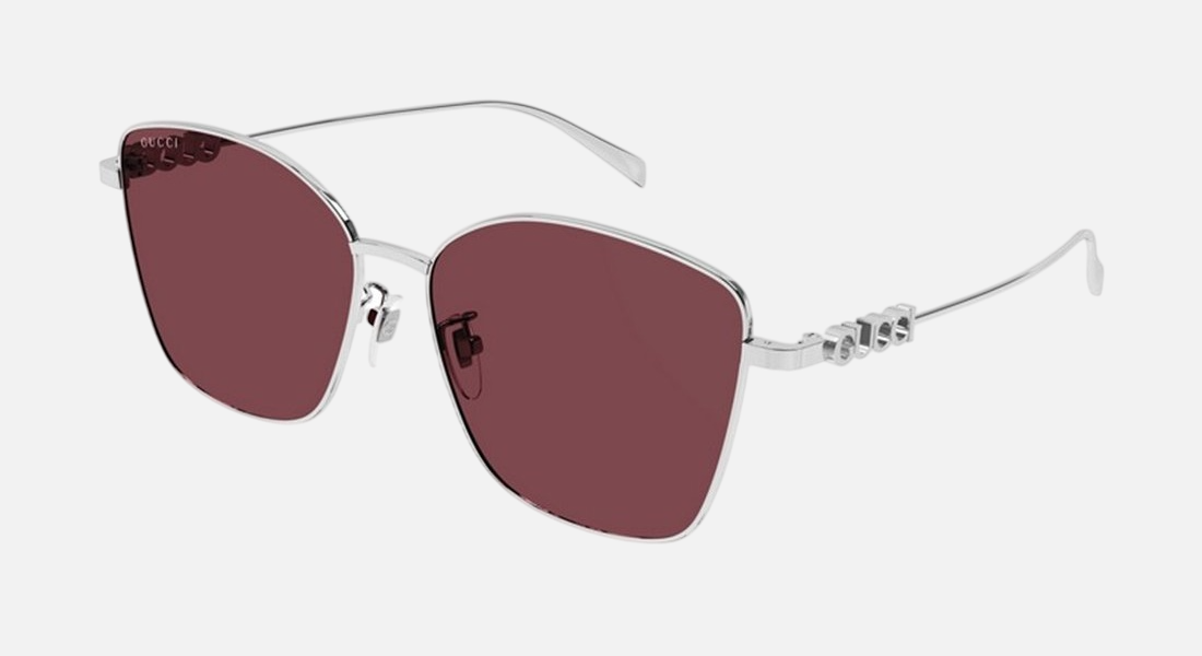 Gucci GG1805SA 004 cat eye sunglasses for women in full rim metal, with silver frame, and red lenses. 60mm in lens size, 15mm in bridge size, and 145mm in temple length.