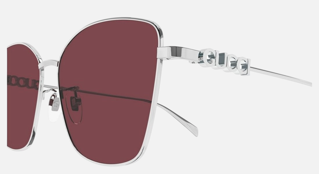 Gucci GG1805SA 004 cat eye sunglasses for women in full rim metal, with silver frame, and red lenses. 60mm in lens size, 15mm in bridge size, and 145mm in temple length.