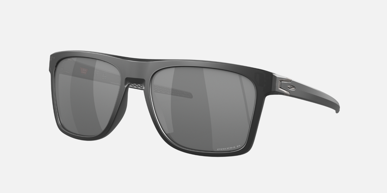 Oakley Leffingwell 04 rectangular sunglasses for men in full rim plastic, with black frame, and black lenses. 57mm in lens size, 17mm in bridge size, and 134mm in temple length.