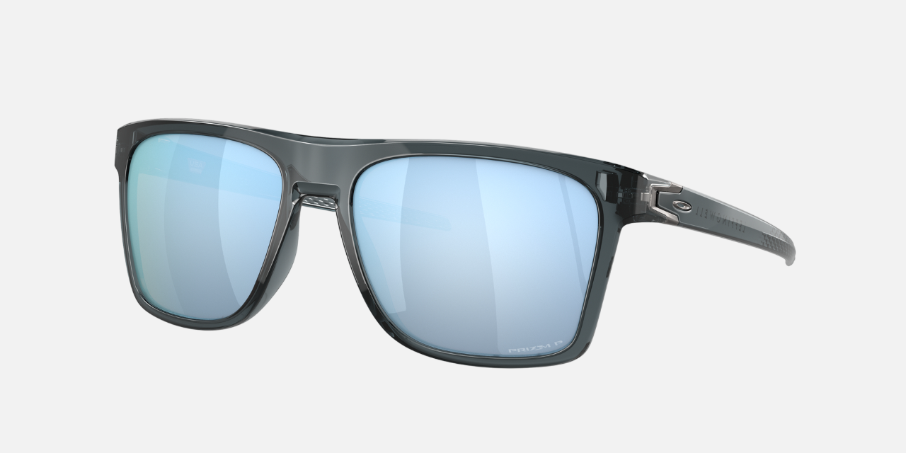Oakley Leffingwell 05 rectangular sunglasses for men in full rim plastic, with black frame, and blue lenses. 57mm in lens size, 17mm in bridge size, and 134mm in temple length.