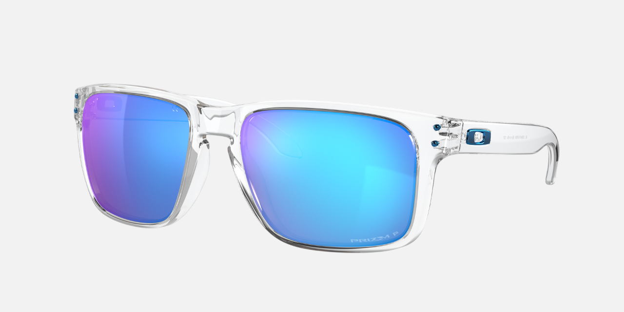 Oakley Holbrook XL 07 rectangular sunglasses for men in full rim plastic, with transparent frame, and blue lenses. 59mm in lens size, 18mm in bridge size, and 137mm in temple length.