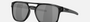 Oakley Latch Beta 05 rectangular sunglasses for men in full rim plastic, with black frame, and black lenses. 54mm in lens size, 18mm in bridge size, and 140mm in temple length.