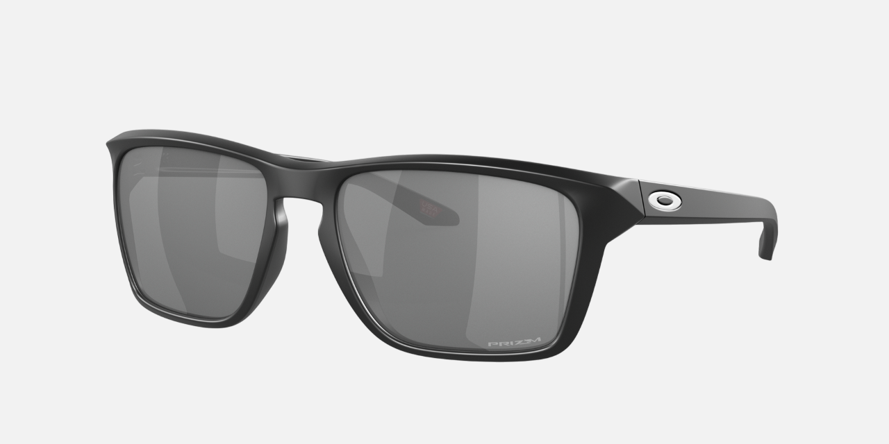Oakley Sylas 03 rectangular sunglasses for men in full rim plastic, with black frame, and black lenses. 57mm in lens size, 17mm in bridge size, and 142mm in temple length.