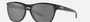 Oakley Manorburn 02 rectangular sunglasses for men in full rim plastic, with black frame, and black lenses. 56mm in lens size, 17mm in bridge size, and 149mm in temple length.