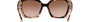 Prada PR 15WS 01R0A6 irregular sunglasses for women in full rim acetate, with havana frame, and brown gradient lenses. 54mm in lens size, 19mm in bridge size, and 140mm in temple length.