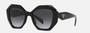 Prada PR 16WS 1AB5D1 irregular sunglasses for women in full rim acetate, with black frame, and grey gradient lenses. 53mm in lens size, 20mm in bridge size, and 145mm in temple length.