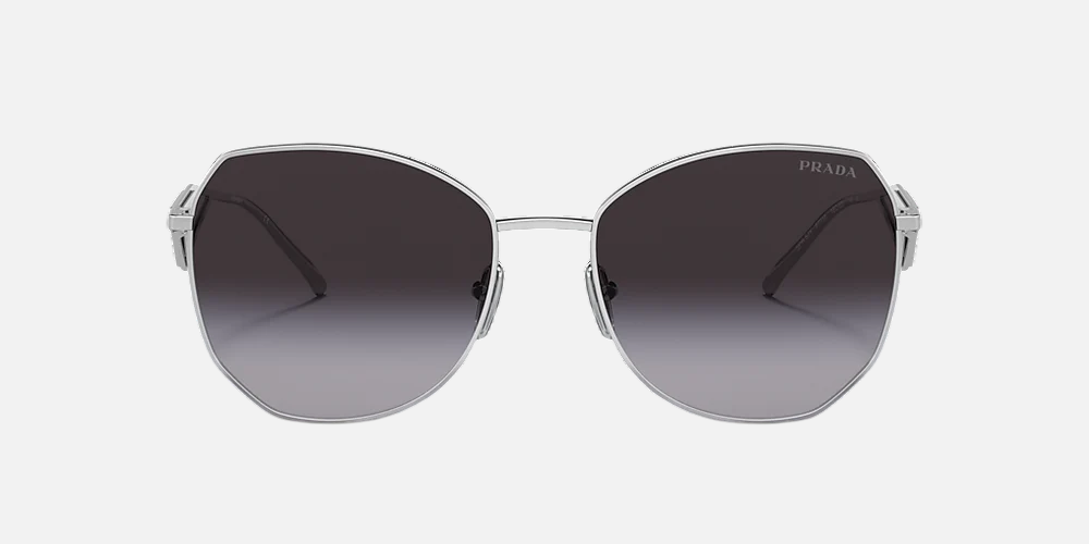 Prada PR 57YS 1BC5D1 irregular sunglasses for women in full rim metal, with silver frame, and grey gradient lenses. 57mm in lens size, 18mm in bridge size, and 140mm in temple length.