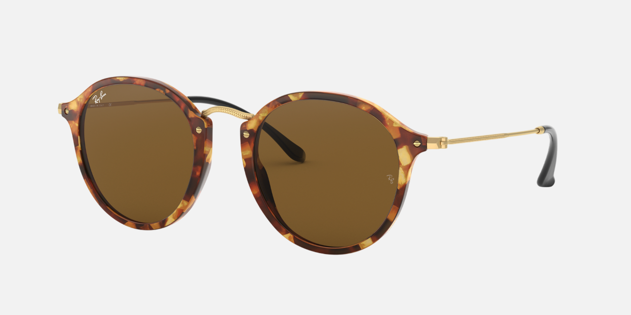 Ray-Ban Round Fleck RB2447 1160 unisex's full rim round sunglasses in a polished brown havana
 acetate frame with b-15 brown
 lenses. Features a 49 mm lens size, 21 mm bridge size, and 145 mm temple length. Available in Dubai, UAE.