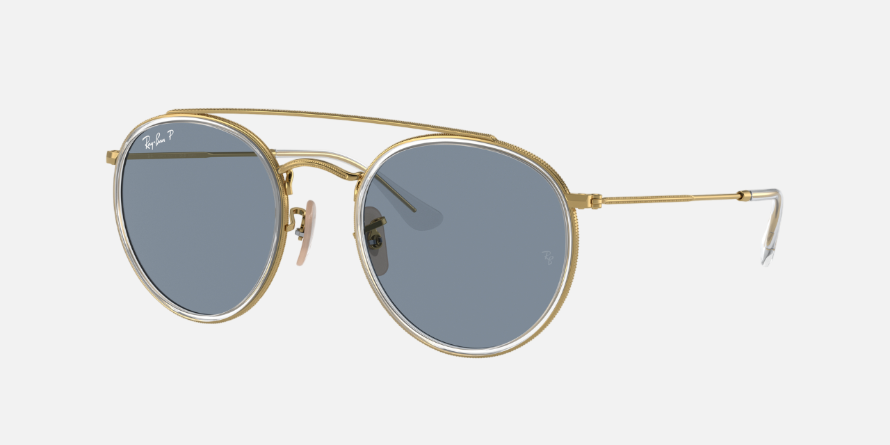 Ray-Ban Round Double Bridge RB3647N 001/02 unisex's full rim round sunglasses in a polished arista gold metal frame with blue polarized lenses. Features a 51 mm lens size, 22 mm bridge size, and 145 mm temple length. Available in Dubai, UAE.