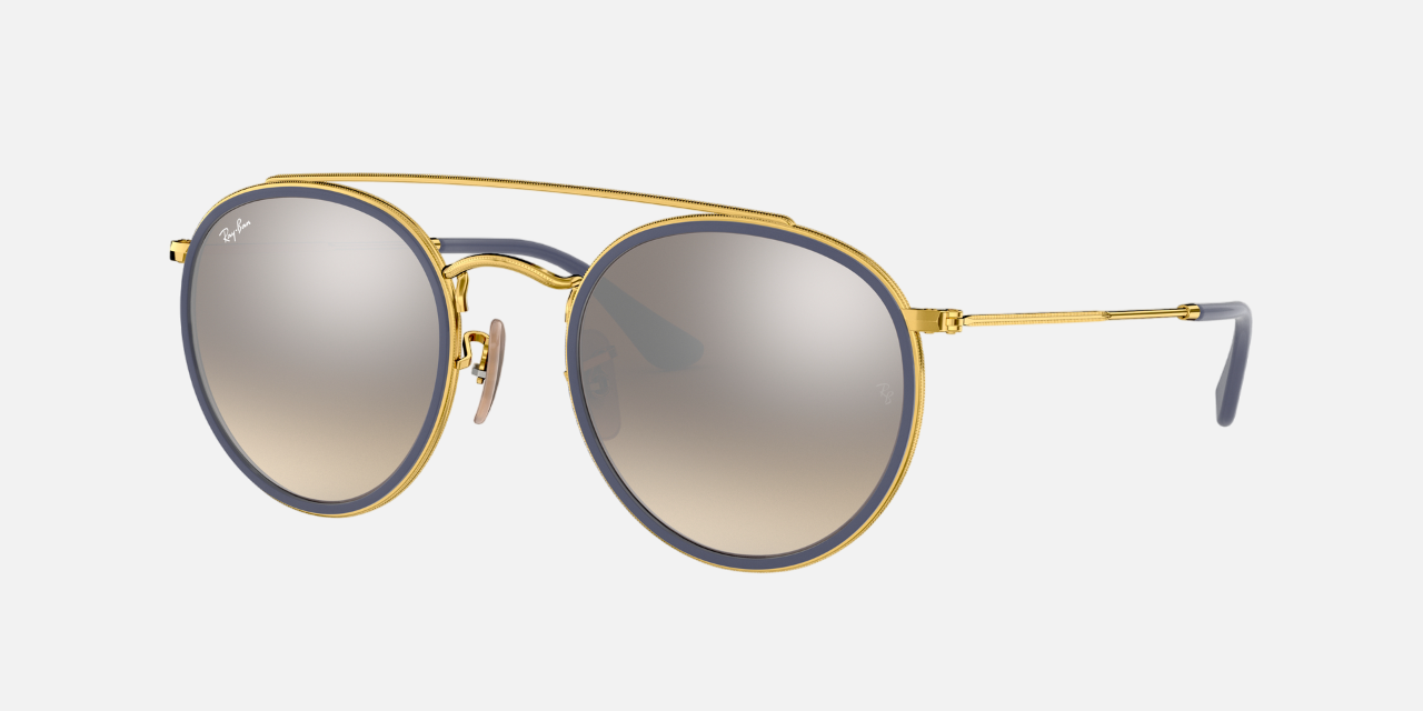 Ray-Ban Round Double Bridge RB3647N 001/9U unisex's full rim round sunglasses in a polished arista gold
 metal frame with silver gradient flash lenses. Features a 51 mm lens size, 22 mm bridge size, and 145 mm temple length. Available in Dubai, UAE.