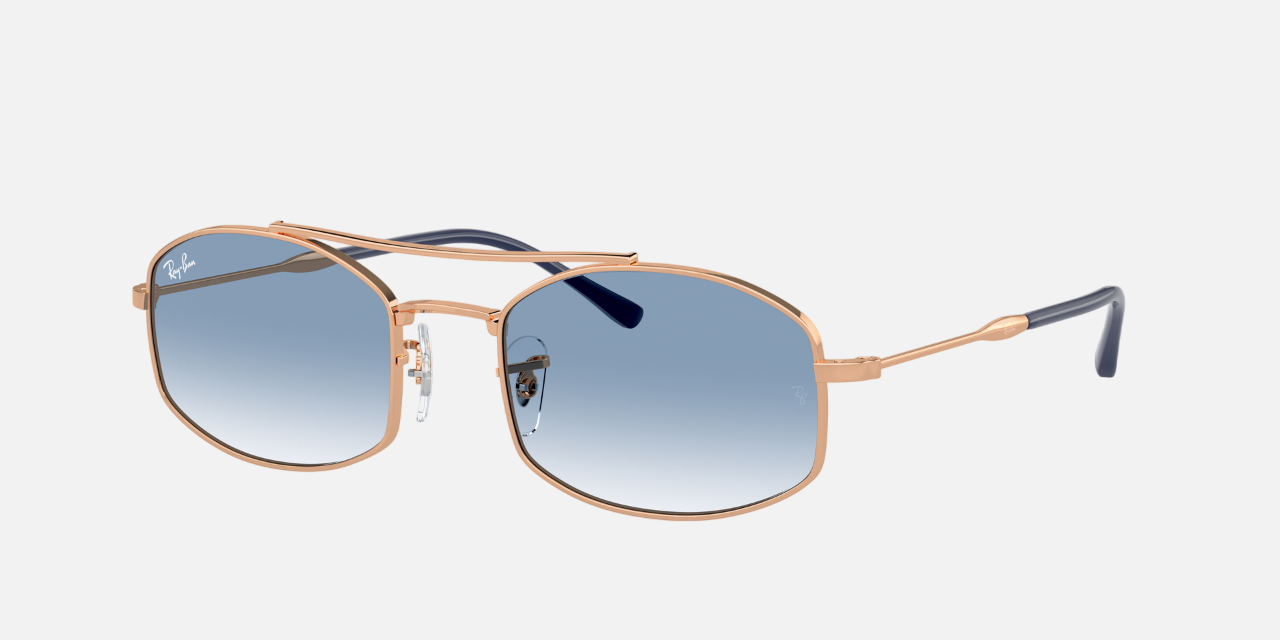 Ray-Ban RB3719 92623F unisex's full rim oval sunglasses in a polished rose gold metal frame with light blue lenses. Features a 54 mm lens size, 20 mm bridge size, and 145 mm temple length. Available in Dubai, UAE.