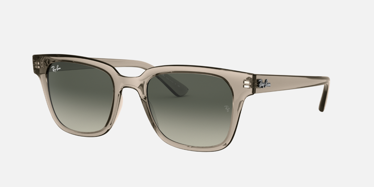 Ray-Ban RB4323 644732 unisex's full rim square sunglasses in a polished transparent injected frame with light grey gradient lenses. Features a 51 mm lens size, 20 mm bridge size, and 150 mm temple length. Available in Dubai, UAE.