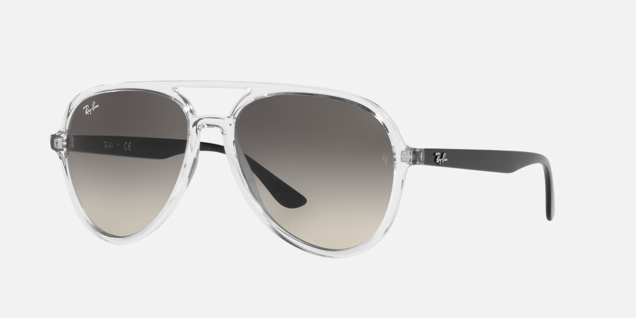 Ray-Ban RB4376 647711 unisex's full rim pilot sunglasses in a polished transparent injected frame with grey gradient lenses. Features a 57 mm lens size, 16 mm bridge size, and 145 mm temple length. Available in Dubai, UAE.