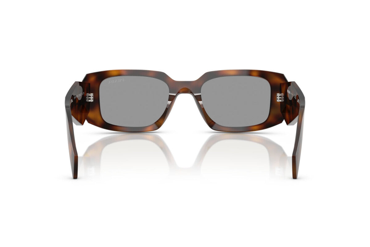 Prada PR 17WS 20D50Q rectangular sunglasses for women in full rim acetate, with havana frame, and grey lenses. 49mm in lens size, 20mm in bridge size, and 145mm in temple length.