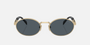 Prada PR 65ZS ZVN09T oval sunglasses for women in full rim metal, with pale gold frame, and dark grey lenses. 55mm in lens size, 20mm in bridge size, and 140mm in temple length.